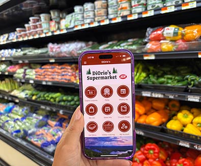 hand holding a phone with the Diorios mobile app shown